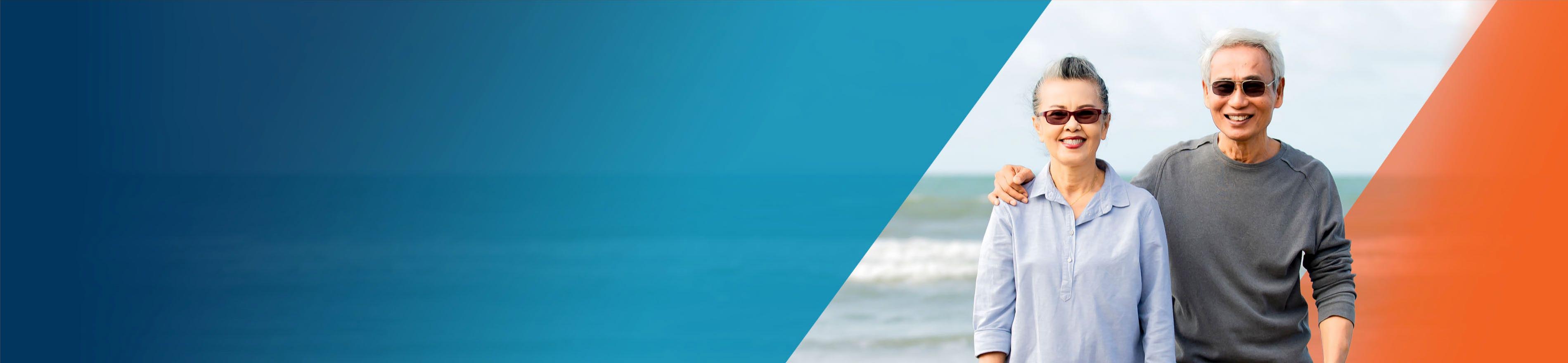 Potential OPDIVO® (nivolumab) user and her husband standing on a beach.