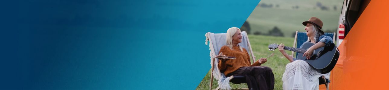 Potential OPDIVO® (nivolumab) user playing guitar to her partner in a field.