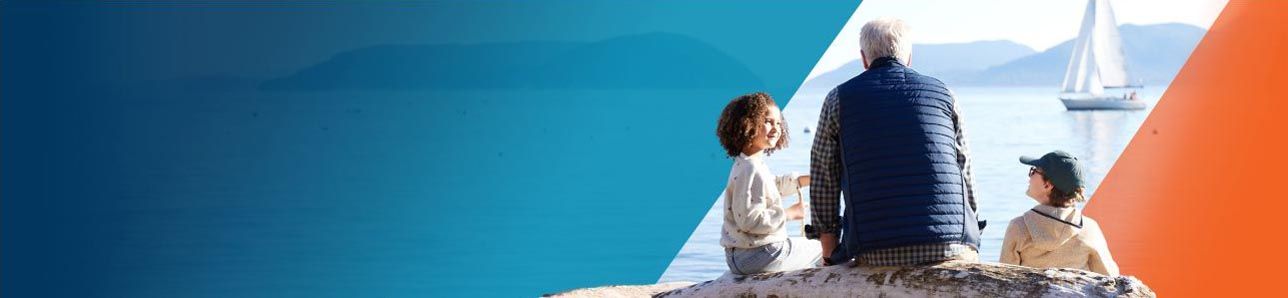 Potential OPDIVO® (nivolumab) user, sitting with his grandchildren watching sailboats.