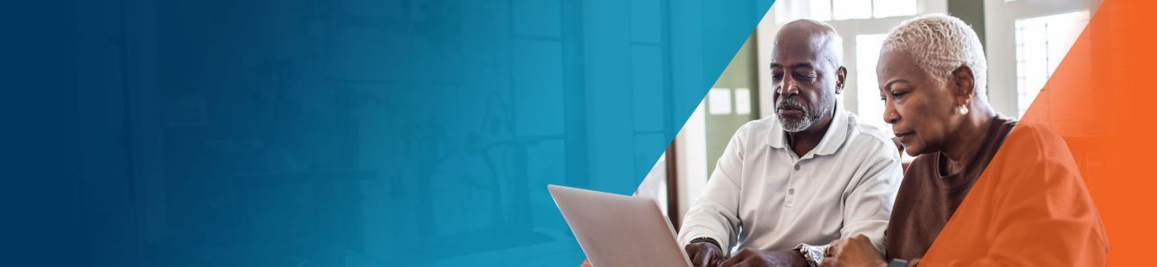Potential OPDIVO® (nivolumab) user on his laptop with his wife.