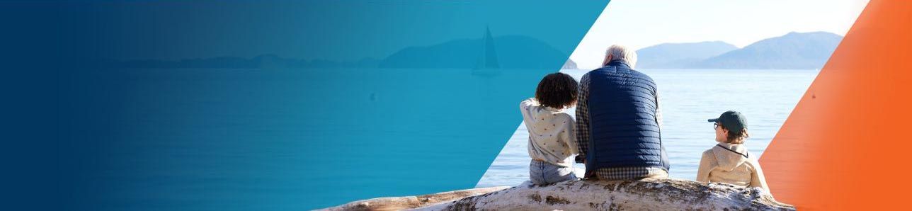 Potential OPDIVO® (nivolumab) user watching sailboats on a lake with his grandchildren.