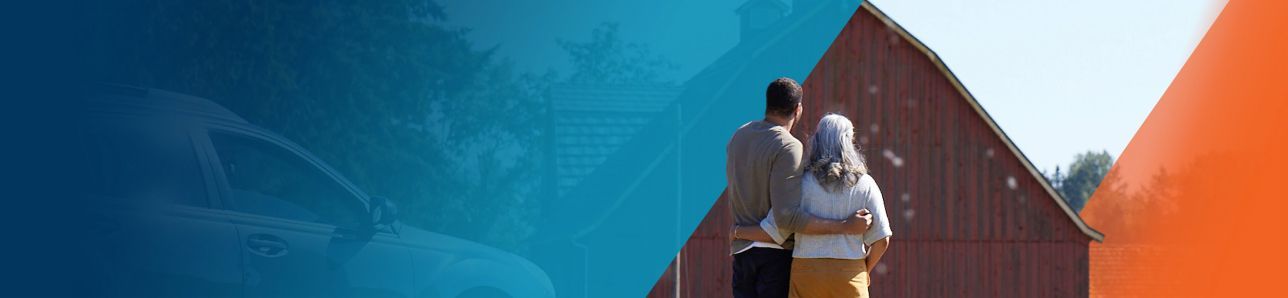 Potential OPDIVO® (nivolumab) user embracing her son while looking at their barn.