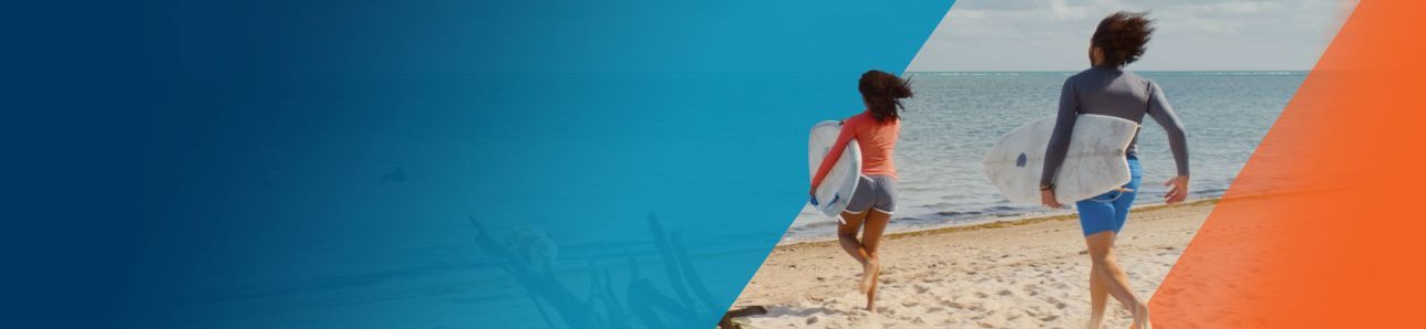 Potential OPDIVO® (nivolumab) user with his friend, running to the ocean to surf.