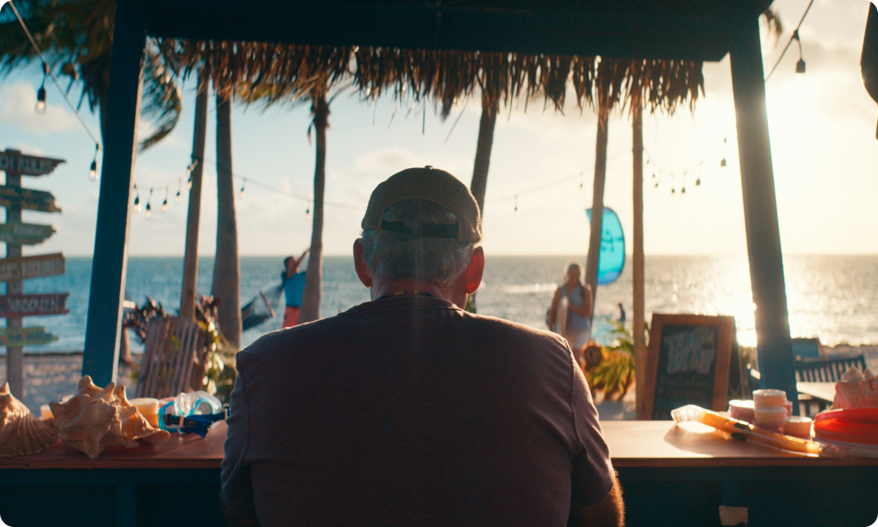 Potential OPDIVO® (nivolumab) user sitting and looking out into the shore.