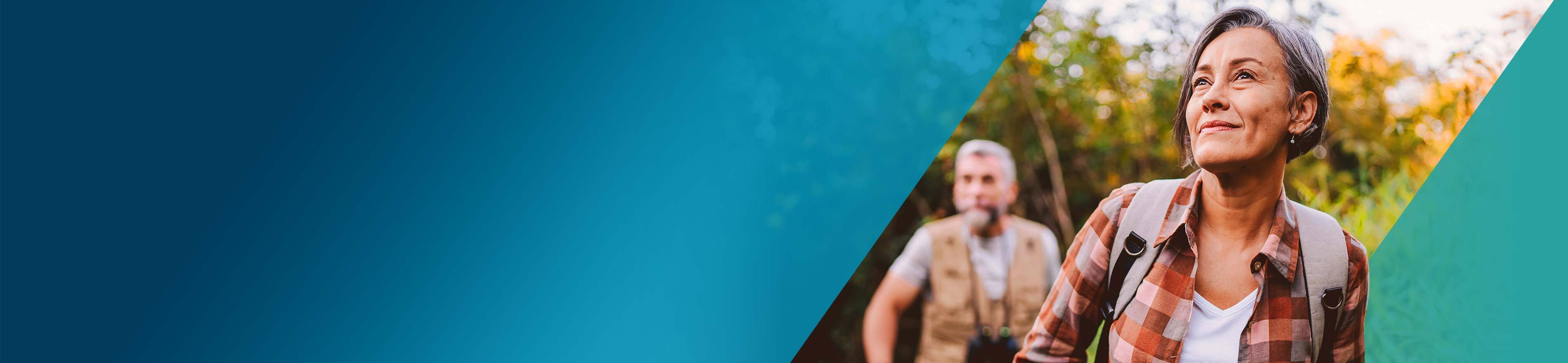 Actor portrayal of an OPDIVO Qvantig® patient hiking outdoors with their partner.